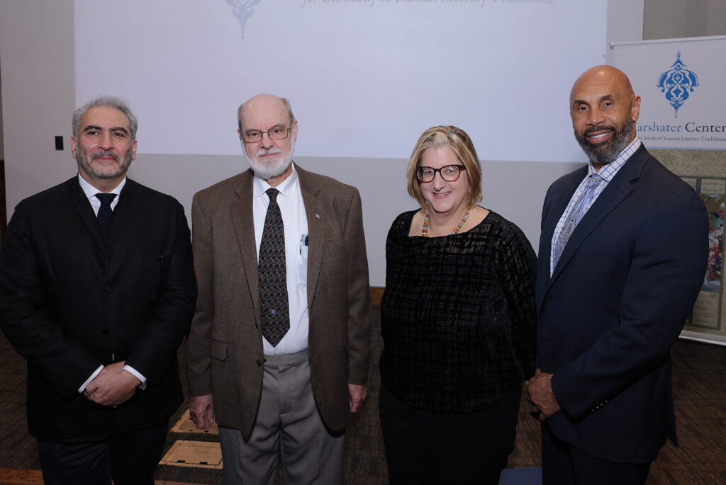Photo depicting four UCLA faculty members celebrating the launch of the UCLA Yarshater Center for the Study of Iranian Literary Traditions